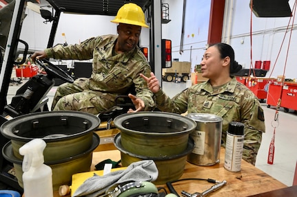 U.S. Army 1st Sgt. Angeli Viyar, Company First Sergeant standardizations instructor/senior flight medic, Delta Company 1-224th Aviation Regiment, discusses daily tasks with a member of the District of Columbia Army National Guard Aviationat Davison Army Airfield, Feb. 3, 2024.  DCARNG Aviation is comprised of four different units with women visibly represented in all sections to include pilots, maintainers, supply, operations, administration, and flight paramedics.