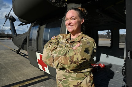 CW2 Lauren A. Bloch, UH-60 medevac instructor pilot, Detachment 2 Company G 2-104th GSAB, District of Columbia National Guard, stands for a photograph at Davison Army Airfield, Feb. 3, 2024.  DCARNG Aviation is comprised of four different units with women visibly represented in all sections to include pilots, maintainers, supply, operations, administration, and flight paramedics.
