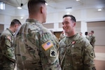 Spc. Alexander Weimer, assigned to Bravo Company, 545th Brigade Engineer Battalion, 45th Infantry Brigade Combat Team, Oklahoma Army National Guard, speaks with Col. Andrew Ballenger, commander of the 45th IBCT at his Oklahoma Star of Valor Ceremony at the Muskogee Armed Forces Reserve Center, Muskogee, Oklahoma, March 3, 2024. Weimer was recognized for his bravery and compassion while assisting civilians involved in a vehicular collision while on his way to drill. (Oklahoma Army National Guard by Cpl. Danielle Rayon)