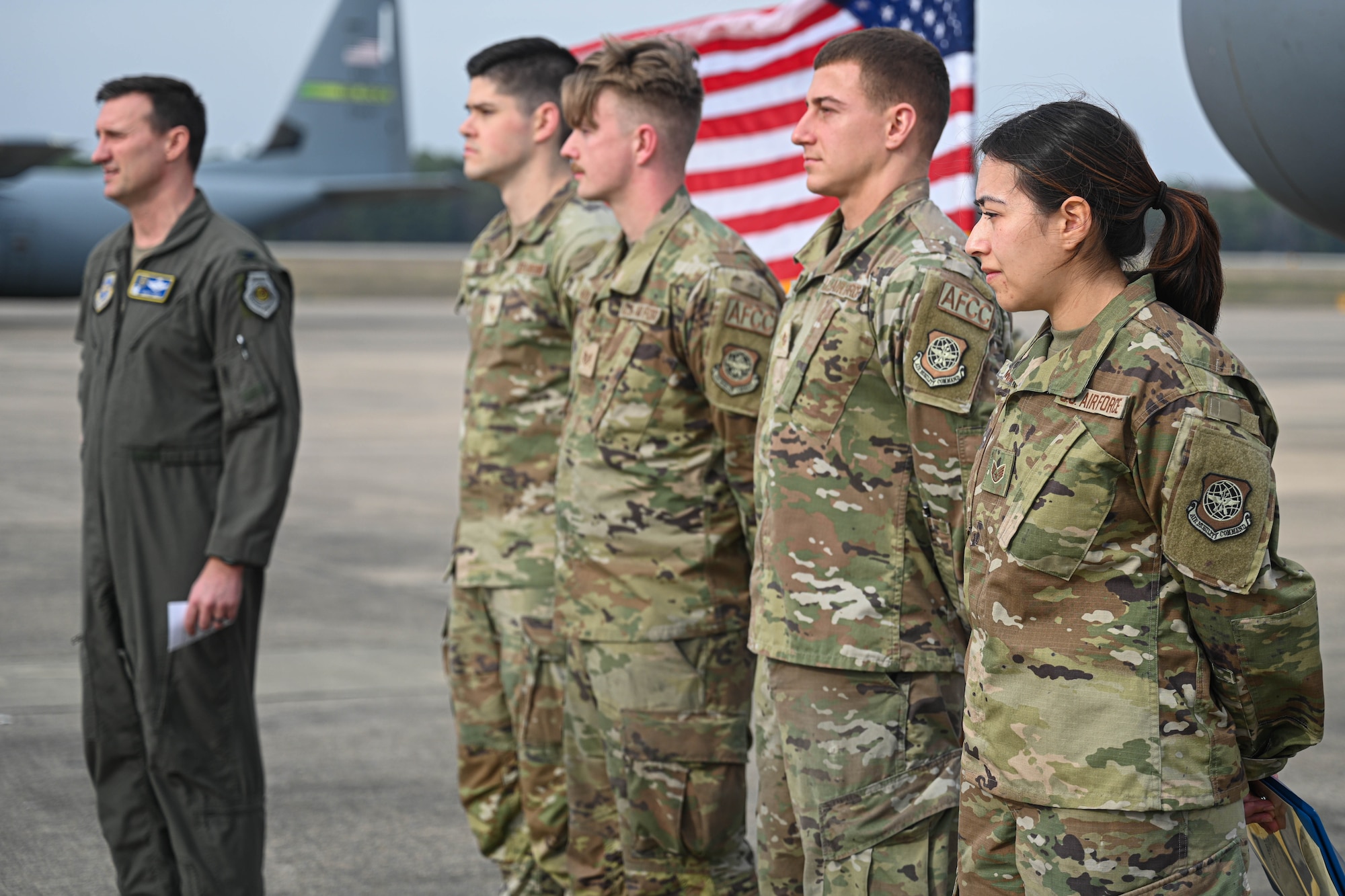 Airmen accept a coin for their performance during a recent maximum endurance operation at Little Rock Air Force Base, Arkansas, Feb. 26, 2024. During the operation, two C-130J Super Hercules from the 41st Airlift Squadron conducted a roughly 30-hour single-aircraft maximum endurance mission demonstrating multi-day mission generation capabilities while only landing to refuel.