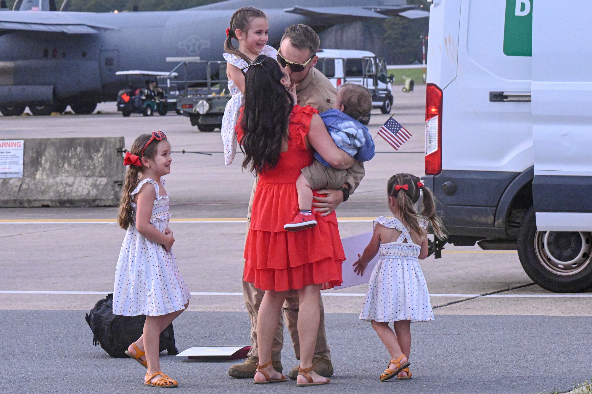 Airman greets family members.