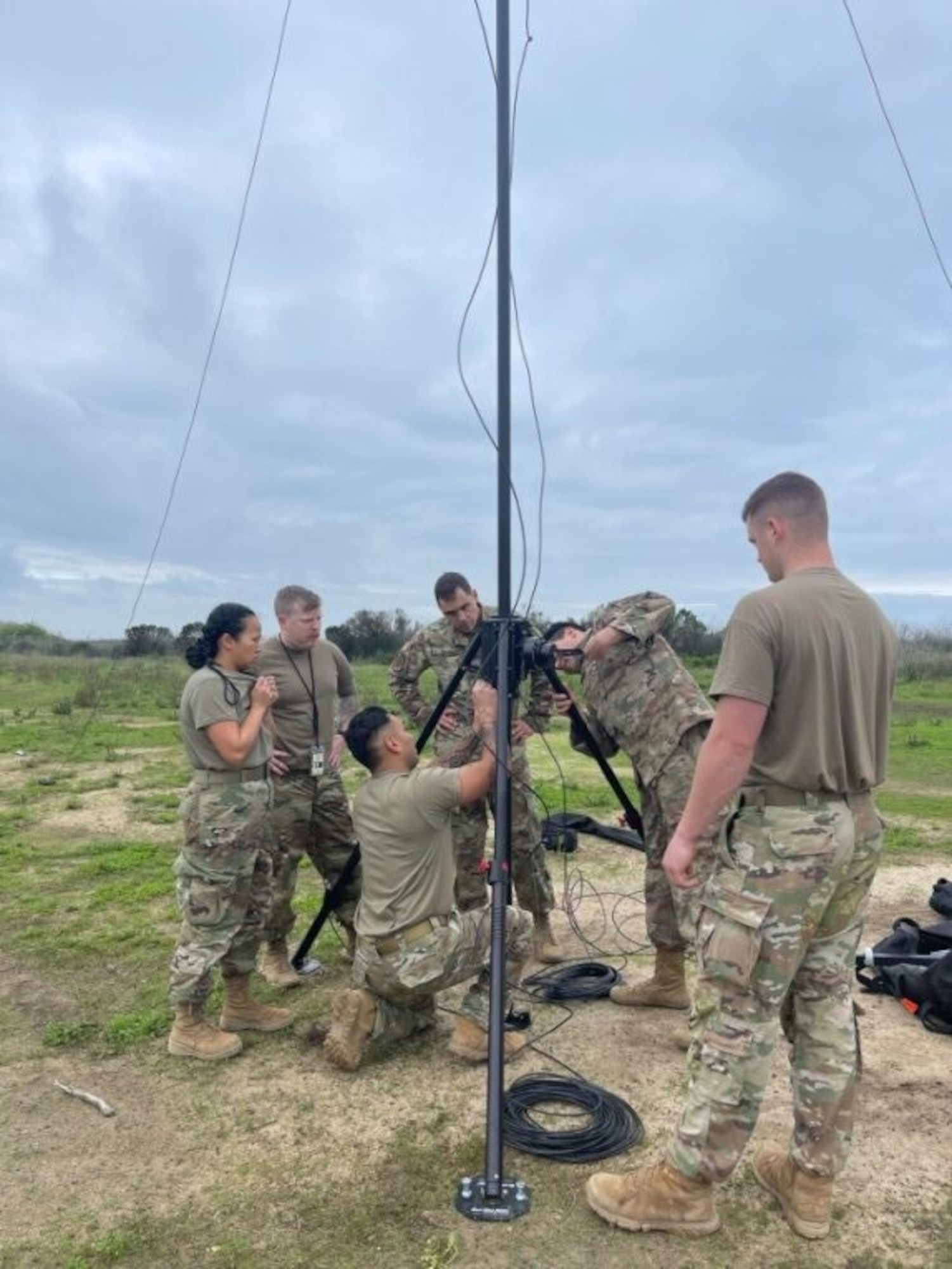 Airmen assigned to the 726th Air Control Squadron set up antennae to gain radio operations