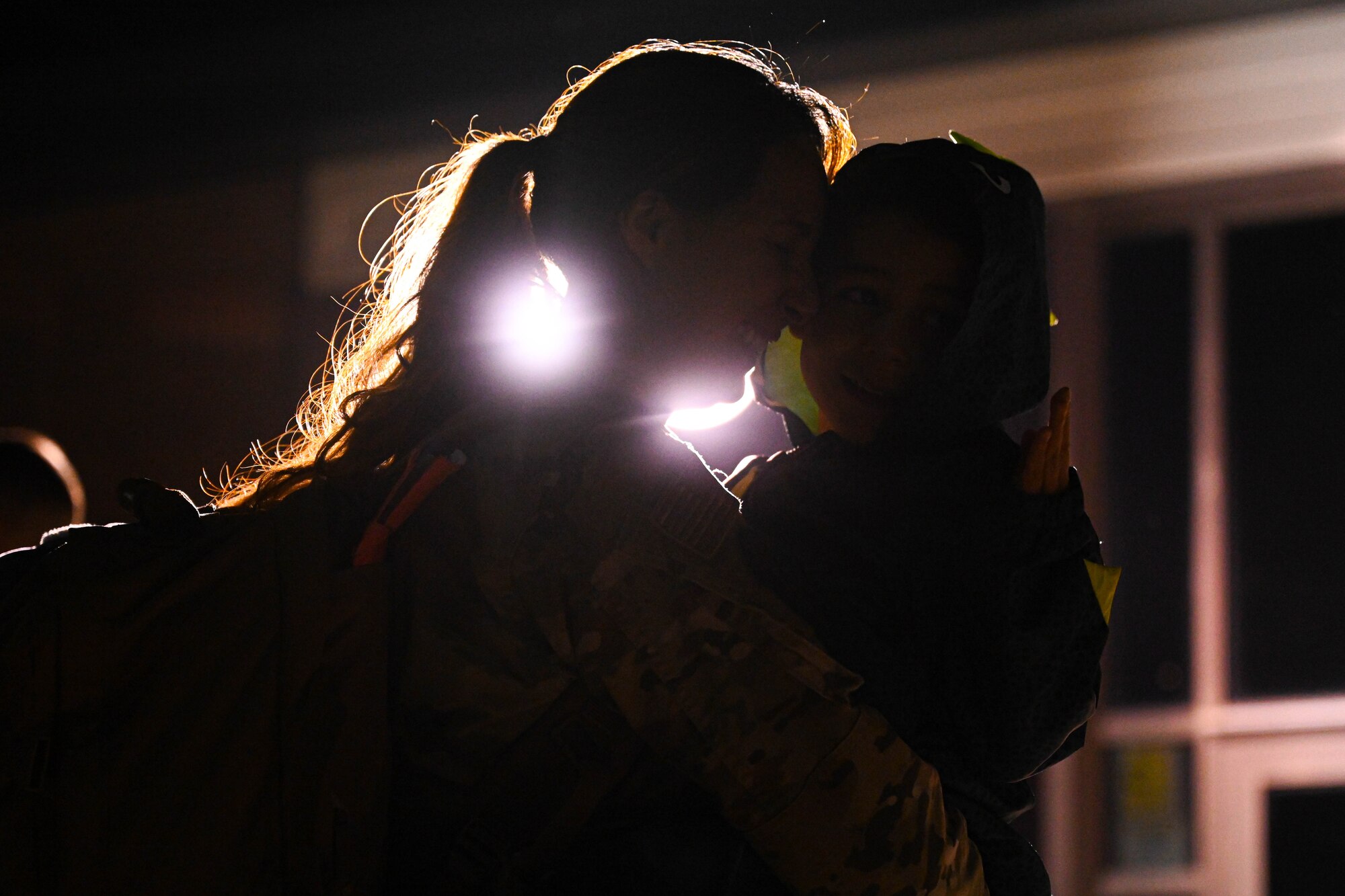 An Airman greets family.