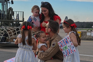 An Airman greets family.