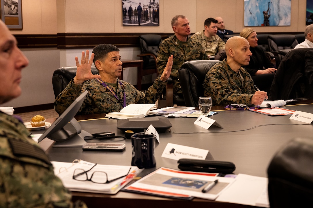 U.S. Marine Corps Maj. Gen. John Kelliher, Commanding General, 4th Marine Aircraft Wing, Marine Forces Reserve, inquires about the National Strategy for the Arctic Region’s (NSAR) Implementation Plan in a brief with a joint-service delegation during Distinguished Visitor’s (DV) Day as part of exercise Arctic Edge 2024 (AE24) at Joint Base Elmendorf-Richardson, Alaska, March 4, 2024. The arctic is a unique arena where 21st-century geostrategic competition intersects with global challenges, holding strategic importance for the United States and the North Atlantic Treaty Organization (NATO). AE24 DV Day fostered dynamic discussions among military, government, and academic leaders on arctic homeland defense, later featuring site visits, demonstrations, and presentations. Arctic Edge 2024 is a U.S. Northern Command-led homeland defense exercise demonstrating the U.S. military’s capabilities in extreme cold weather, joint force readiness, and U.S. military commitment to mutual strategic security interests in the arctic region. (U.S. Marine Corps photo by Lance Cpl. Madisyn Paschal)