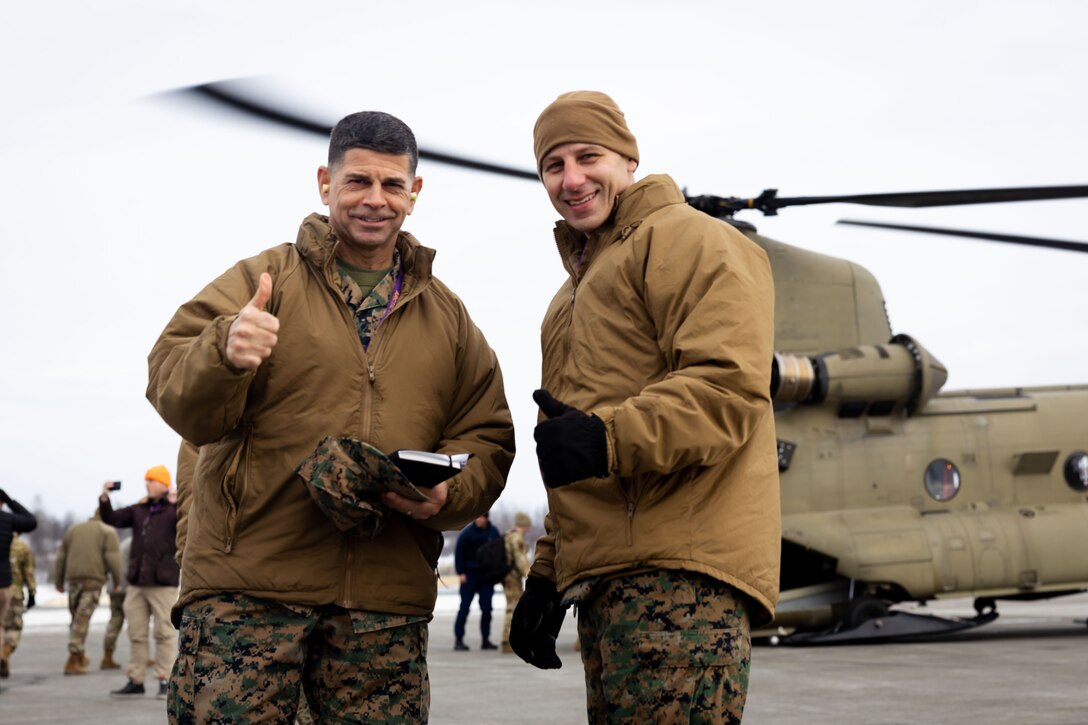 U.S. Marine Corps Maj. Gen. John Kelliher, Commanding General, 4th Marine Aircraft Wing, Marine Forces Reserve, poses for a photo with Sgt. Maj. Daniel Heider, sergeant major of 4th Marine Aircraft Wing, Marine Forces Reserve, before boarding a Boeing CH-47 Chinook aircraft alongside a joint-service delegation during Distinguished Visitor’s (DV) Day as part of exercise Arctic Edge 2024 (AE24) at Joint Base Elmendorf-Richardson, Alaska, March 4, 2024. The delegation visited and toured Port MacKenzie. AE24 DV Day served as a dynamic forum and facilitated discussions among military leaders, government officials, and academic experts on key issues related to the future of homeland defense in the arctic. The event featured site visits, demonstrations, and presentations, emphasizing the integration of diverse perspectives to strengthen regional partnerships. Arctic Edge 2024 is a U.S. Northern Command-led homeland defense exercise demonstrating the U.S. military’s capabilities in extreme cold weather, joint force readiness, and U.S. military commitment to mutual strategic security interests in the arctic region. (U.S. Marine Corps photo by Lance Cpl. Madisyn Paschal)