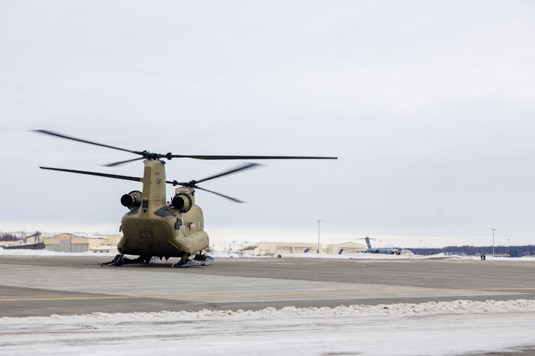 U.S. Marine Corps Maj. Gen. John Kelliher, Commanding General, 4th Marine Aircraft Wing, U.S. Marine Corps Forces Reserve, departs in a Boeing CH-47 Chinook aircraft alongside a joint-service delegation during Distinguished Visitor’s (DV) Day as part of exercise Arctic Edge 2024 (AE24) at Joint Base Elmendorf-Richardson, Alaska, March 4, 2024. The delegation visited and toured Port MacKenzie. AE24 DV Day served as a dynamic forum and facilitated discussions among military leaders, government officials, and academic experts on key issues related to the future of homeland defense in the arctic. The event featured site visits, demonstrations, and presentations, emphasizing the integration of diverse perspectives to strengthen regional partnerships. Arctic Edge 2024 is a U.S. Northern Command-led homeland defense exercise demonstrating the U.S. military’s capabilities in extreme cold weather, joint force readiness, and U.S. military commitment to mutual strategic security interests in the arctic region. (U.S. Marine Corps photo by Lance Cpl. Madisyn Paschal)