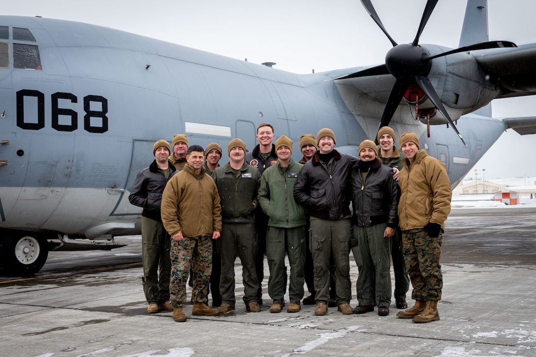 U.S. Marine Corps Maj. Gen. John Kelliher, Commanding General, 4th Marine Aircraft Wing, Marine Forces Reserve, poses for a photo with the Marines of Marine Aerial Refueler Transport Squadron (VMGR) 234, Marine Aircraft Group 41, 4th Marine Aircraft Wing, Marine Forces Reserve during Distinguished Visitor’s (DV) Day as part of exercise Arctic Edge 2024 (AE24) at Joint Base Elmendorf-Richardson, Alaska, March 4, 2024. Kelliher discussed the strategic importance of operating in an austere environment and commemorated the Marines on their resiliency. Training in an arctic environment cultivates a resilient force adept at adapting to extreme conditions, guaranteeing preparedness for potential conflicts in challenging terrains, and augmenting the overall proficiency of armed forces to operate effectively in diverse and demanding scenarios. Arctic Edge 2024 is a U.S. Northern Command-led homeland defense exercise demonstrating the U.S. military’s capabilities in extreme cold weather, joint force readiness, and U.S. military commitment to mutual strategic security interests in the arctic region. (U.S. Marine Corps photo by Lance Cpl. Madisyn Paschal)