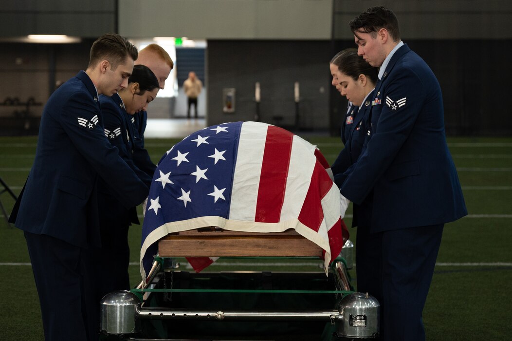 U.S. Air Force Airmen conduct an honorary funeral demonstration as part of their honor guard graduation at Eielson Air Force Base, Alaska.