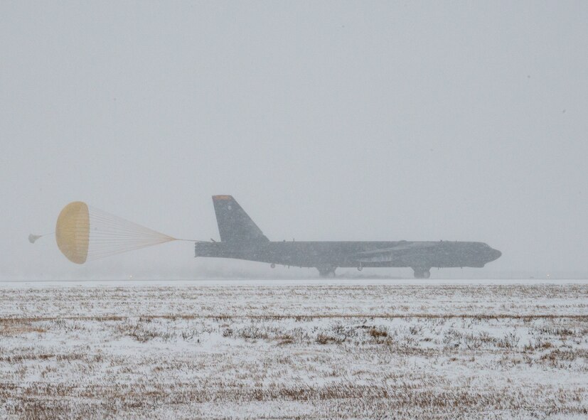 A U.S. B-52H Stratofortress assigned to the 23rd Bomb Squadron deploys its drogue parachute while landing at Minot Air Force Base, North Dakota, March 3, 2024. The aircraft was returning from a deployment to Anderson AFB, Guam, as part of a Bomber Task Force mission which enhanced joint security strategies with Allies and partners, demonstrating the U.S. capability to command, control and conduct bomber missions across the globe.(U.S. Air Force photo by Senior Airman Evan Lichtenhan)
