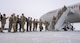 Airmen assigned to the 23rd Expeditionary Bomb Squadron return from a Bomber Task Force (BTF) mission at Minot Air Force Base, North Dakota, March 6, 2024. Airmen returned from a deployment to Anderson AFB, Guam, as part of a BTF mission which enhanced joint security strategies with allies and partners, demonstrating the U.S. capability to command, control and conduct bomber missions across the globe. (U.S. Air Force photo by Airman 1st Class Kyle Wilson)