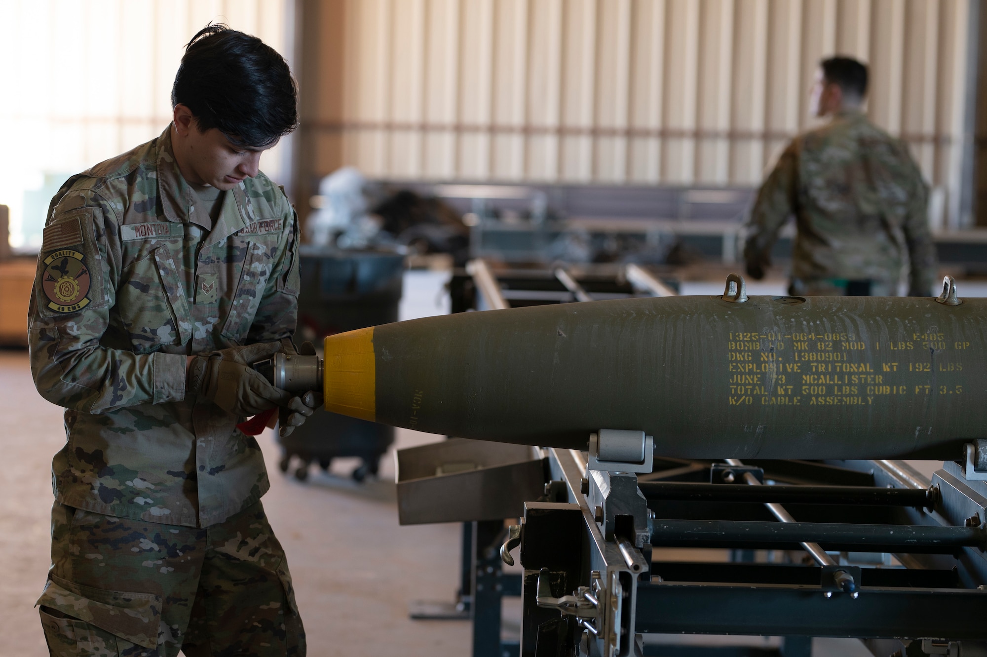 U.S. Air Force Senior Airman Samuel Montoya, 49th Equipment Maintenance Squadron crew chief, constructs a Mark 82 bomb at Holloman Air Force Base, New Mexico, Feb. 21, 2024. Assembling MK-82’s provides realistic training for Airmen in real-time war scenarios to test their readiness capabilities. (U.S. Air Force photo by Airman 1st Class Michelle Ferrari)