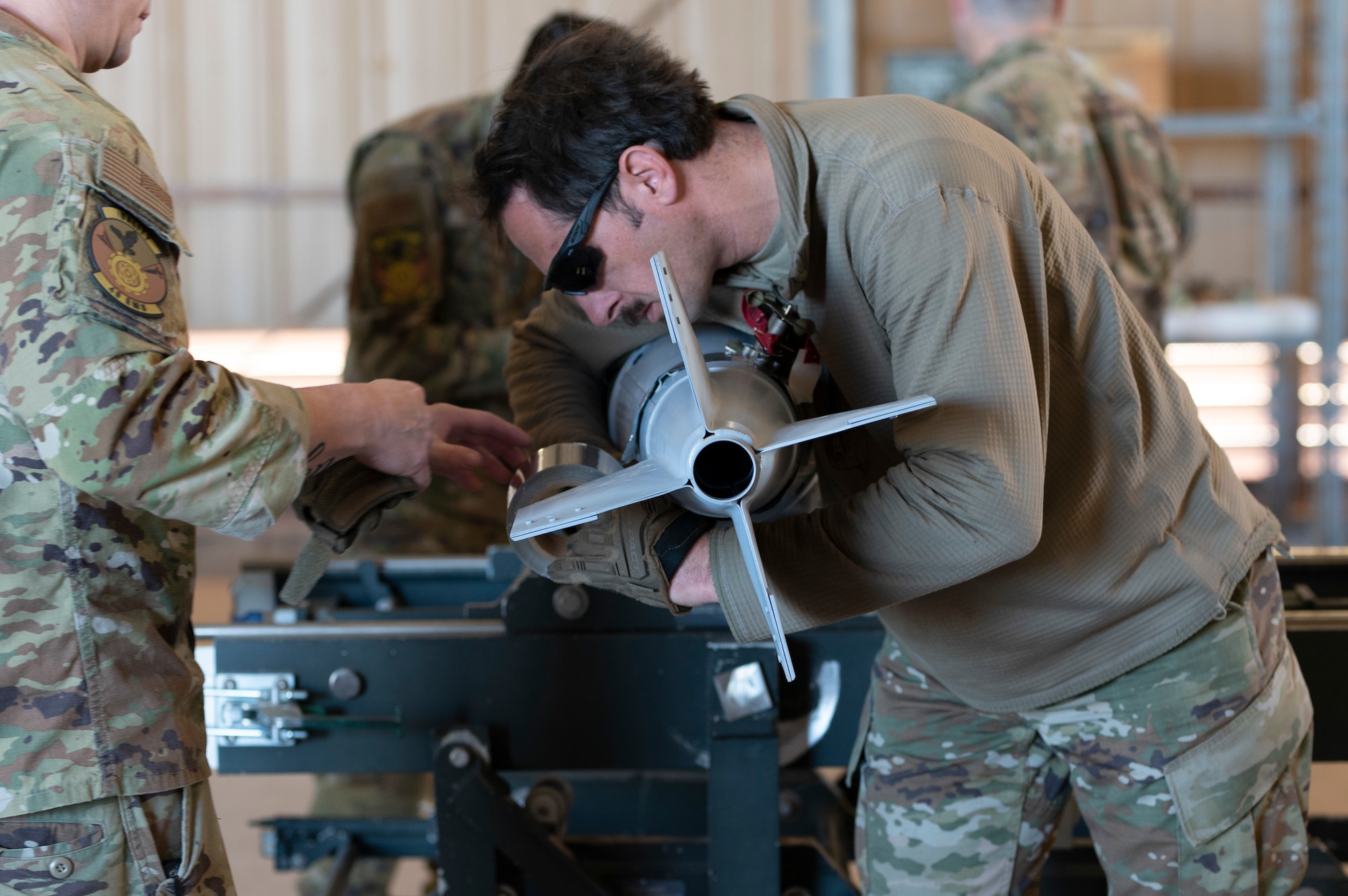 U.S. Air Force Staff Sgt. Spencer Wildman, 49th Equipment Maintenance Squadron crew chief, wraps tape around the fin of a Mark 82 live bomb at Holloman Air Force Base, New Mexico, Feb. 21, 2024. The Mk-82 is a versatile bomb used for various operations that require meticulous assembly, enhancing the training environment to help develop Airmen. (U.S. Air Force photo by Airman 1st Class Michelle Ferrari)