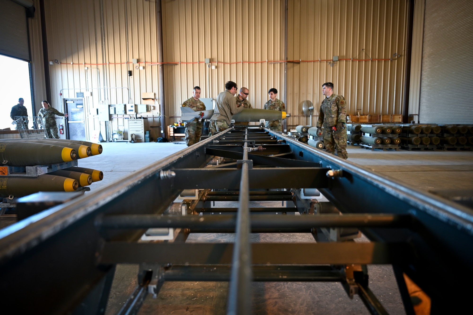 Airmen from the 49th Equipment Maintenance Squadron build a Mark 82 bomb on a Munitions Assembly Conveyor at Holloman Air Force Base, New Mexico, Feb. 21, 2024. Crew members use a Munitions Assembly Conveyor to construct munitions efficiently. (U.S. Air Force photo by Airman 1st Class Michelle Ferrari)