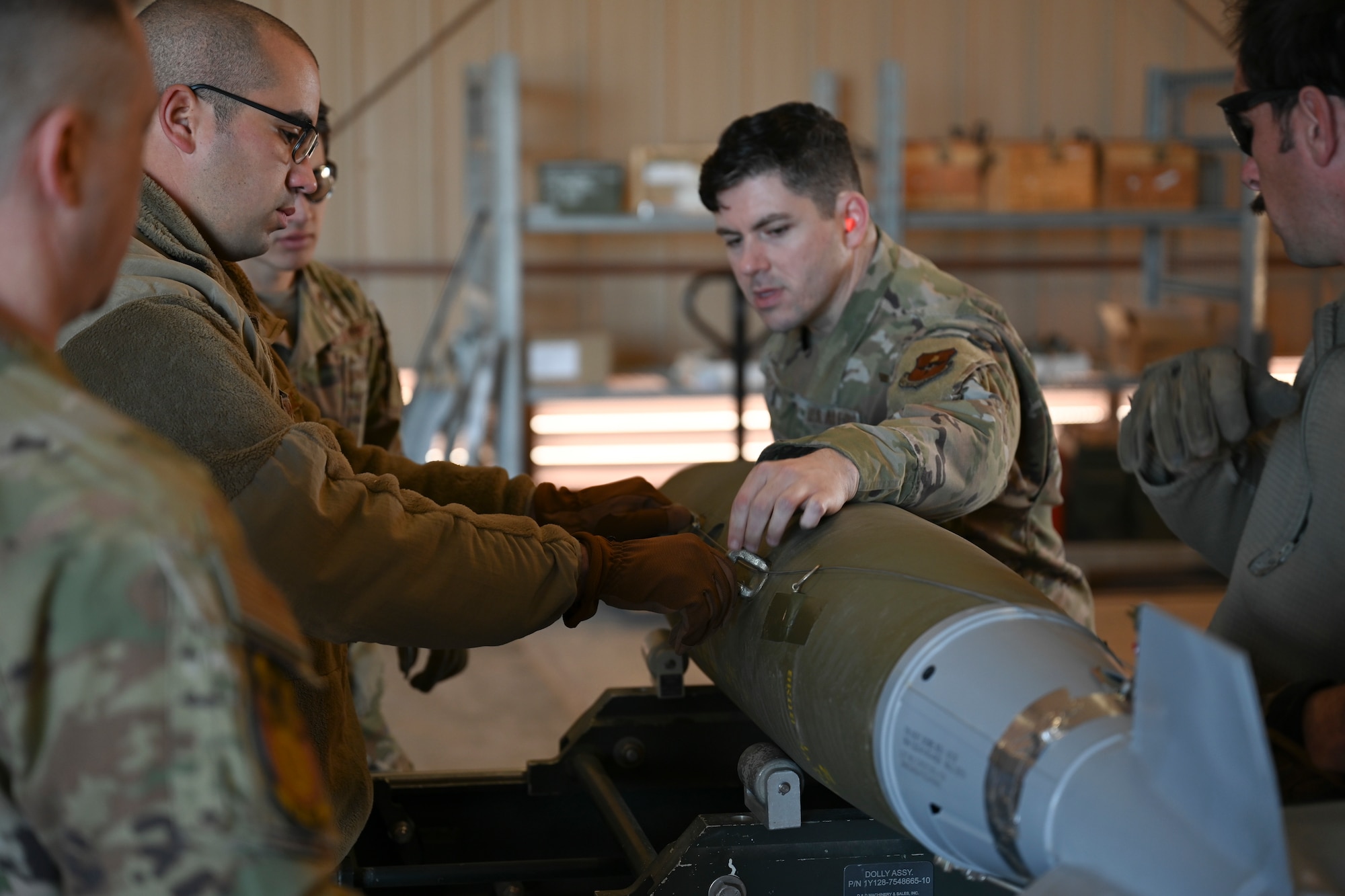 Airmen from the 49th Equipment Maintenance Squadron put together a Mark 82 live bomb at Holloman Air Force Base, New Mexico, Feb. 21, 2024. Assembling MK-82 bombs provides realistic training for Airmen in real-time war scenarios to test their readiness capabilities. (U.S. Air Force photo by Airman 1st Class Michelle Ferrari)