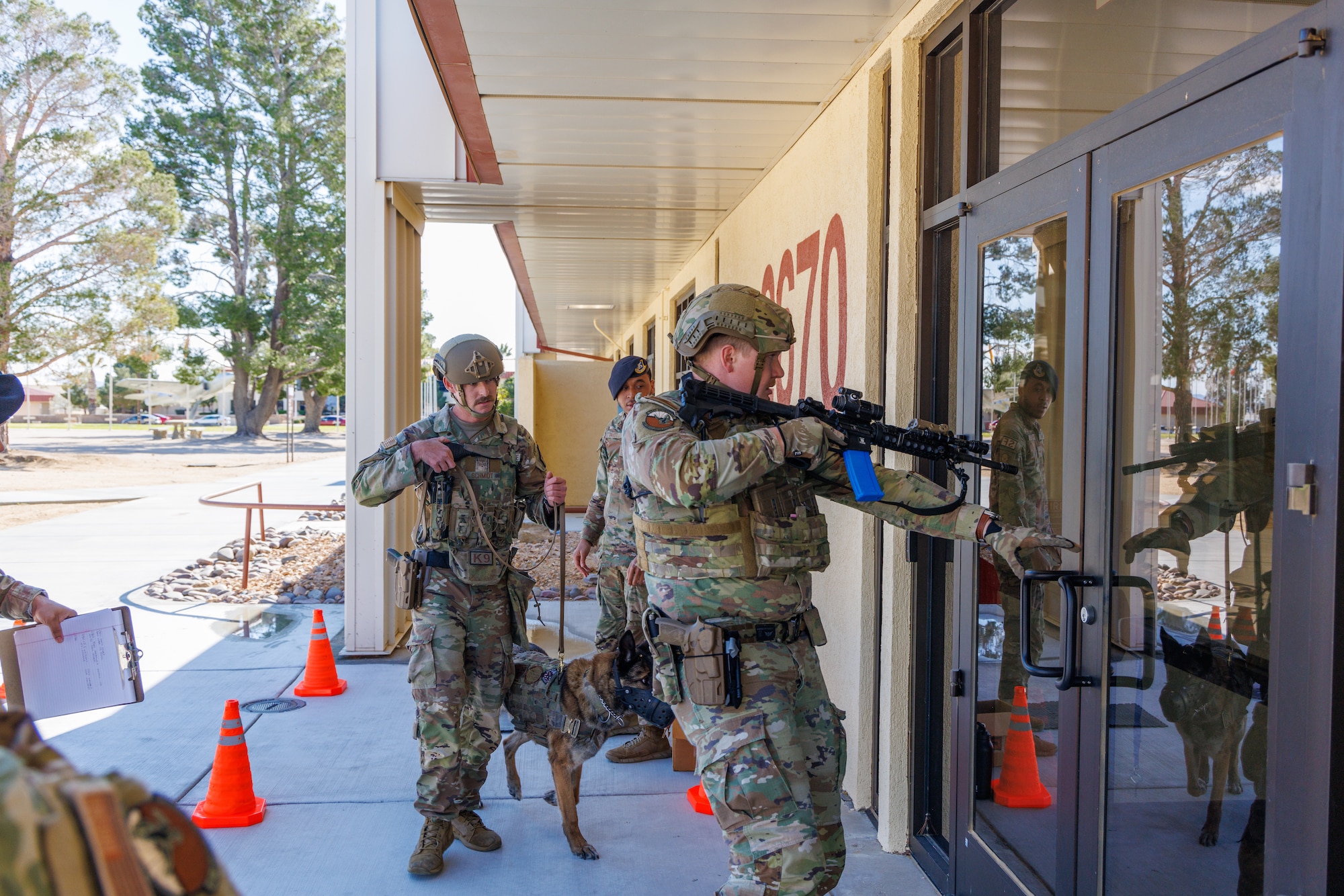 412th Security Forces Squadron prepare to enter a building with a suspected active shooter during an exercise at Edwards Air Force Base, California, March 7. (Air Force photo by C.J. Raterman)