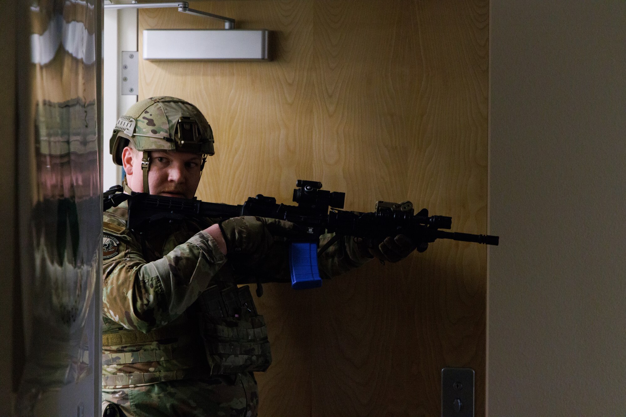 412th Security Forces Squadron member searches for a suspect during an active shooter exercise at Edwards Air Force Base, California, March 7. (Air Force photo by C.J. Raterman)