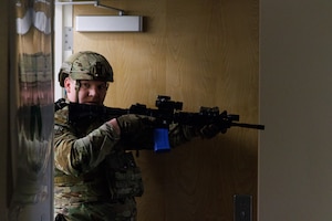 412th Security Forces Squadron members inspect a building during an active shooter exercise at Edwards Air Force Base, California, March 7. (Air Force photo by C.J. Raterman)