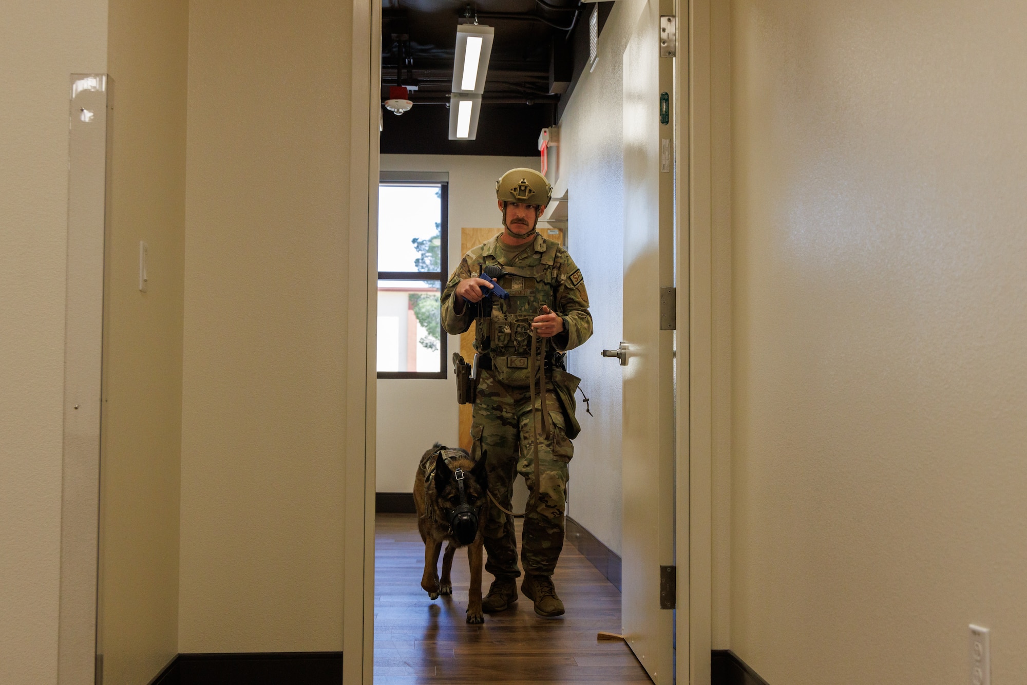 412th Security Forces Squadron members inspect a building during an active shooter exercise at Edwards Air Force Base, California, March 7. (Air Force photo by C.J. Raterman)