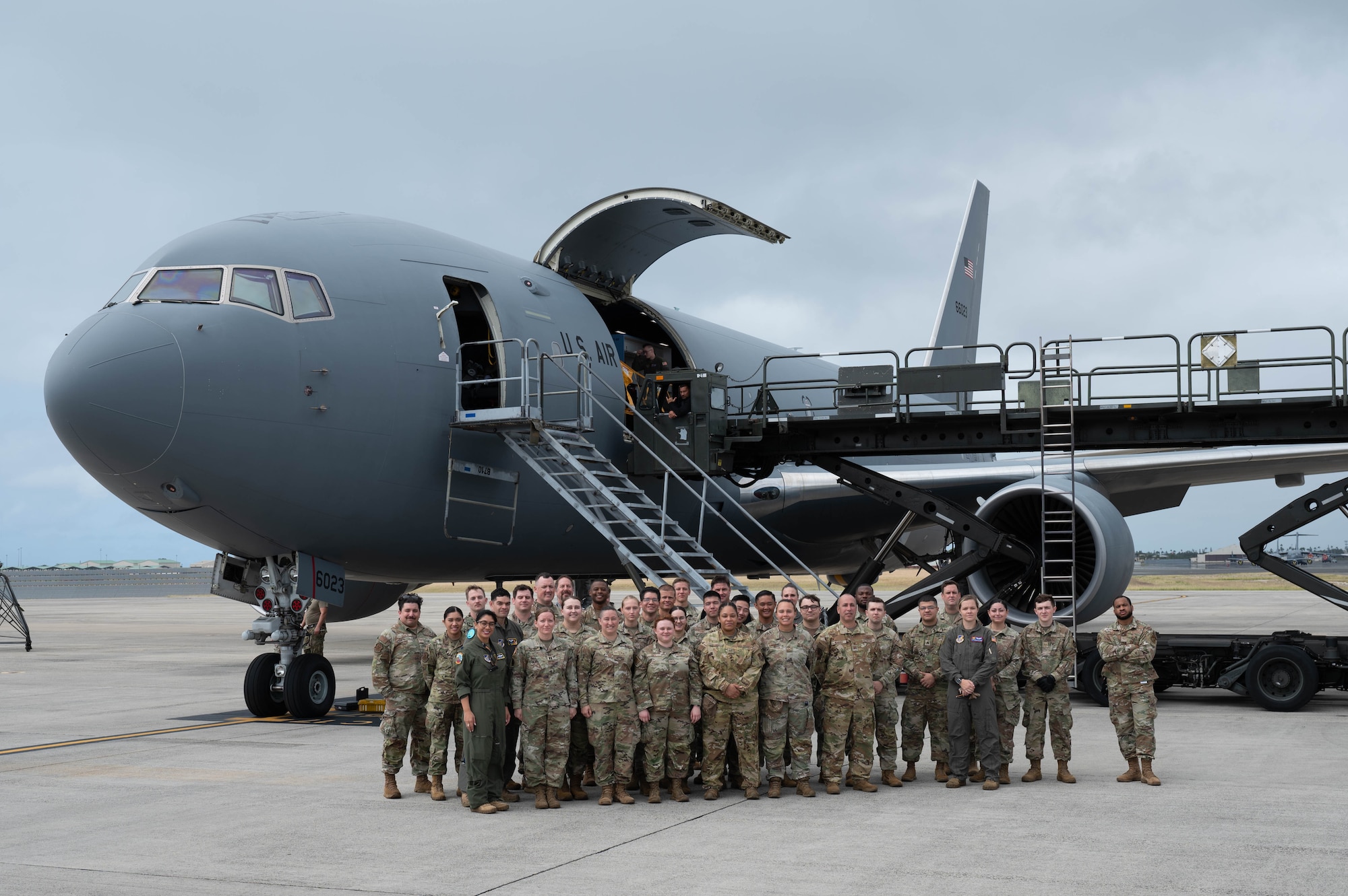 Crew members of the 18th Aeromedical Evacuation Squadron pose for a group photo during a training event at Joint Base Pearl Harbor-Hickam, Hawaii, Feb. 26, 2024. The team worked with several organizations to coordinate and set up specialized medical equipment that will be used to carry out the first AE mission carried out on a KC-46 Pegasus in the Pacific Air Forces area of responsibility. (U.S. Air Force photo by Technical Sgt. Tarelle Walker)