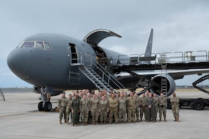 Crew members of the 18th Aeromedical Evacuation Squadron pose for a group photo during a training event at Joint Base Pearl Harbor-Hickam, Hawaii, Feb. 26, 2024. The team worked with several organizations to coordinate and set up specialized medical equipment that will be used to carry out the first AE mission carried out on a KC-46 Pegasus in the Pacific Air Forces area of responsibility. (U.S. Air Force photo by Technical Sgt. Tarelle Walker)