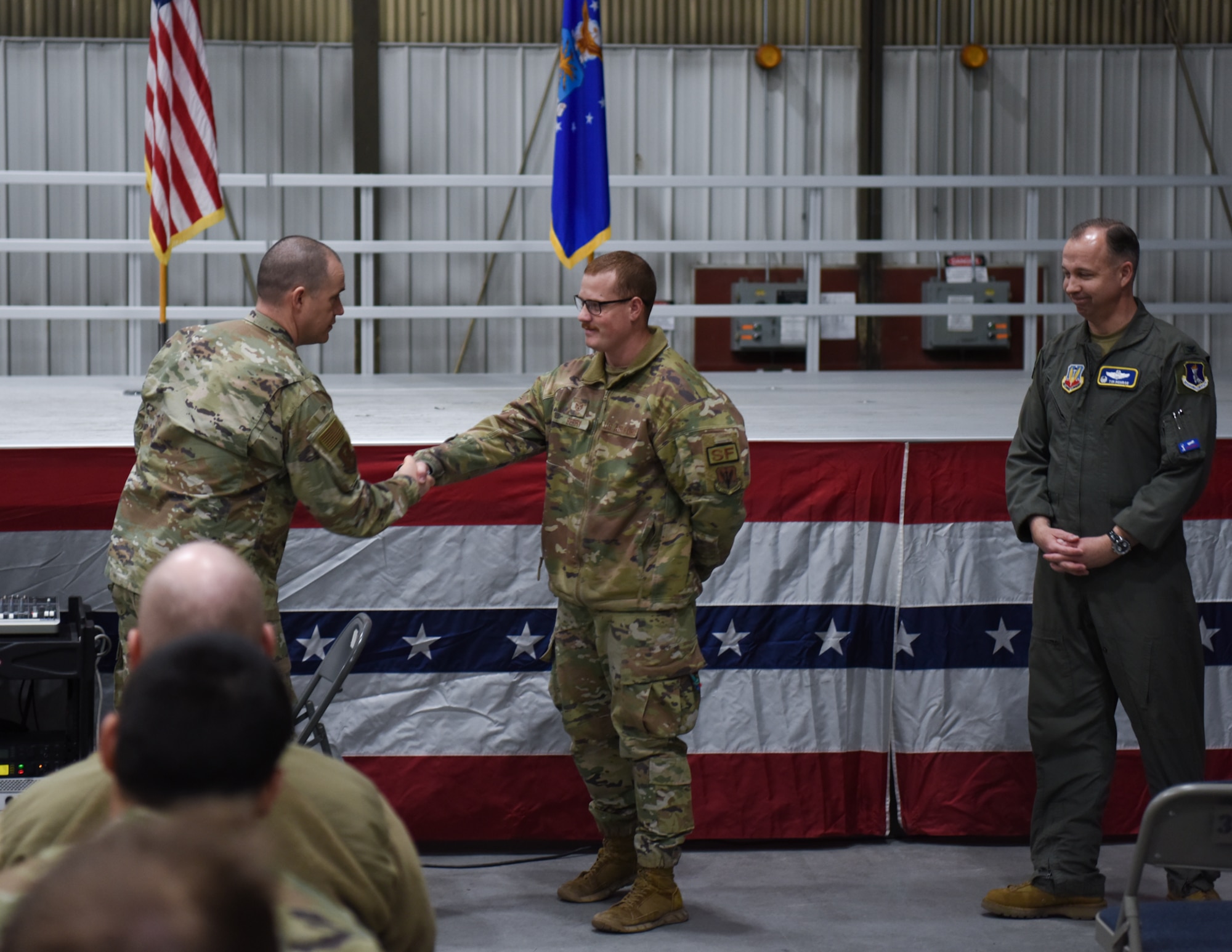 Airmen being addressed at deployment briefing