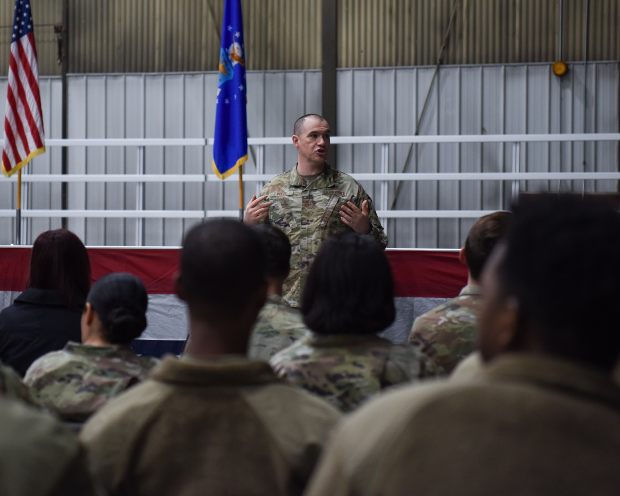Airmen being addressed at deployment briefing