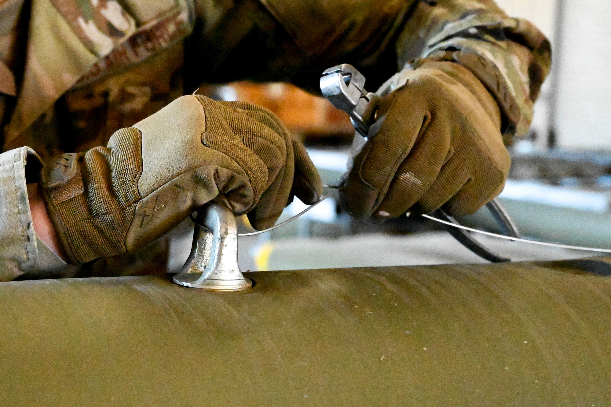 An Airman from the 49th Equipment Maintenance Squadron puts together a Mark 82 bomb at Holloman Air Force Base, New Mexico, Feb. 21, 2024. The Mk-82 is a versatile bomb used for various operations that require meticulous assembly, enhancing the training environment to help develop Airmen. (U.S. Air Force photo by Airman 1st Class Michelle Ferrari)