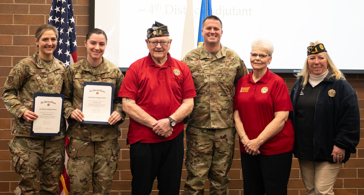 Ken Gibson, center, a volunteer for the Veterans of Foreign Wars and Navy Veteran, poses for a group photo with the U.S. Air Force Master Sgt. Natalie Dornan and Tech. Sgt. Emily Berg, 133rd Maintenance Group in St. Paul, Minn., March 2, 2024.