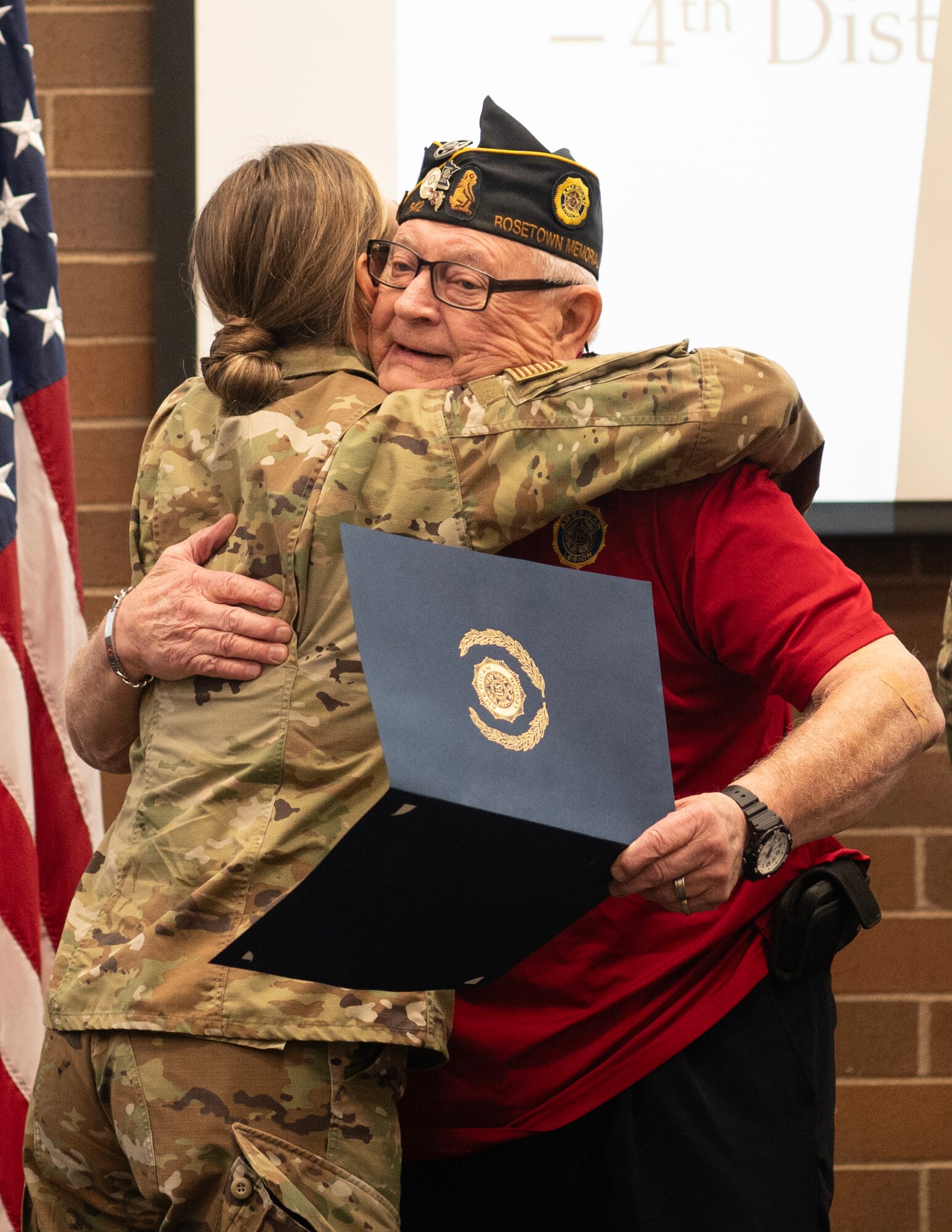 U.S. Air Force Master Sgt. Natalie Dornan, 133rd Maintenance Group, hugs Ken Gibson in St. Paul, Minn., March 2, 2024.