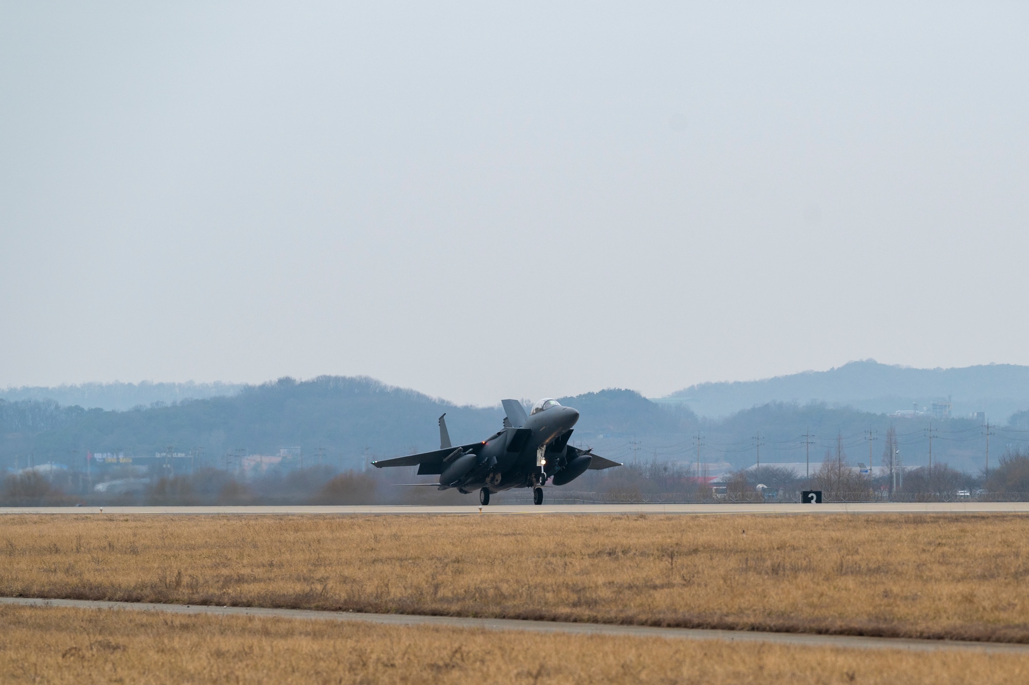 A Republic of Korea F-15K Slam Eagle assigned to the 122nd Fighter Squadron lands after a training mission during Buddy Squadron 24-2 at Osan Air Base, Republic of Korea, March 5, 2024. Buddy Squadron training events are held multiple times a year throughout the year at various U.S. Air Force and Republic of Korea Air Force bases to sharpen combined air combat tactics on the peninsula. The Buddy Squadron Program fosters objective-based training and improves interoperability between the U.S. and ROKAF fighter squadrons. (U.S. Air Force photo by Senior Airman Kaitlin Frazier)