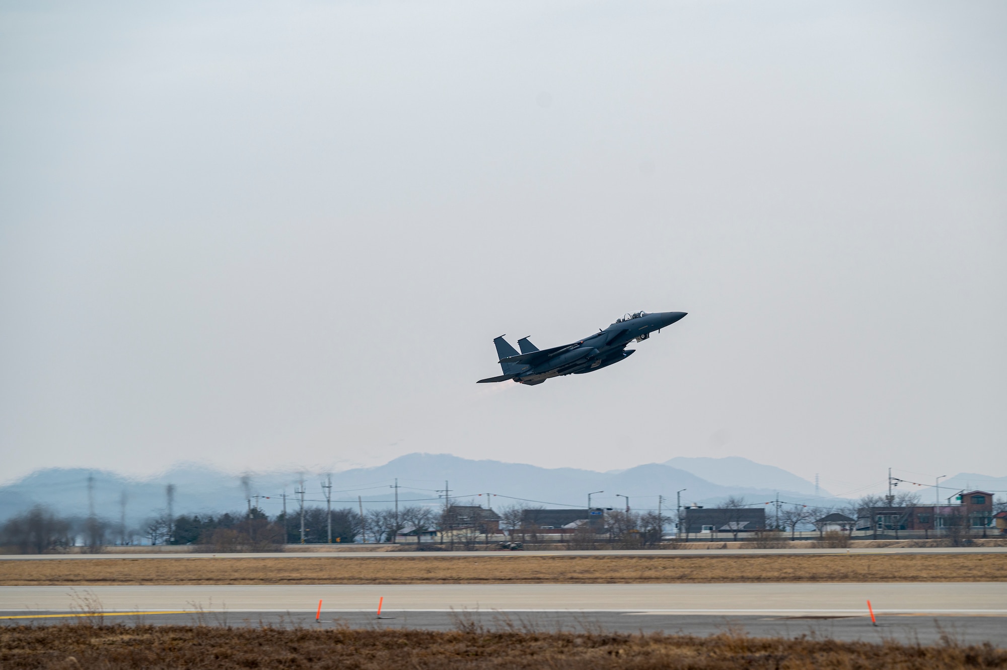 A Republic of Korea F-15K Slam Eagle assigned to the 122nd Fighter Squadron takes off during Buddy Squadron 24-2 at Osan Air Base, Republic of Korea, March 5, 2024. Twenty aircraft were involved in the training event to include the F-15K Slam Eagles, F-16 Fighting Falcons and the A-10 Thunderbolt II. The Buddy Squadron Program fosters objective-based training and improves interoperability between the U.S. and ROKAF fighter squadrons. (U.S. Air Force photo by Senior Airman Kaitlin Frazier)