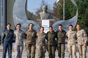 Female service members from the Turkish Air Force U.S. Air Force, Spanish Air Force and Polish Air Force stand shoulder to shoulder in front of the Mustafa Kemal Ataturk Memorial statue for International Women’s Day on Incirlik Air Base, Türkiye, March 4, 2024.