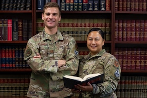 U.S. Air Force Capt. Cole Altman, left, Dover Area Defense Counsel, and U.S. Air Force Senior Airman Nicole Hart, right, Dover ADC defense paralegal, stand in their office on Dover Air Force Base, Delaware, March 6, 2024. Altman and Hart provide free representation to Airmen on matters ranging from the Air Force Office of Special Investigations and Security Forces investigations, administrative discharges, and court-martials. (U.S. Air Force photo by Roland Balik)