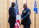 Retired Chief Master Sgt. Ramon Perez, right, receives the Meritorious Service Medal from U.S. Air Force Col. Jarrett Virgil, 16th Air Force Air National Guard advisor to the commander during a retirement ceremony at MacDill Air Force Base, Florida, March 2, 2024. Perez retired after 36
years of service. (U.S. Air National Guard photo by Senior Airman Brooke Keisler)