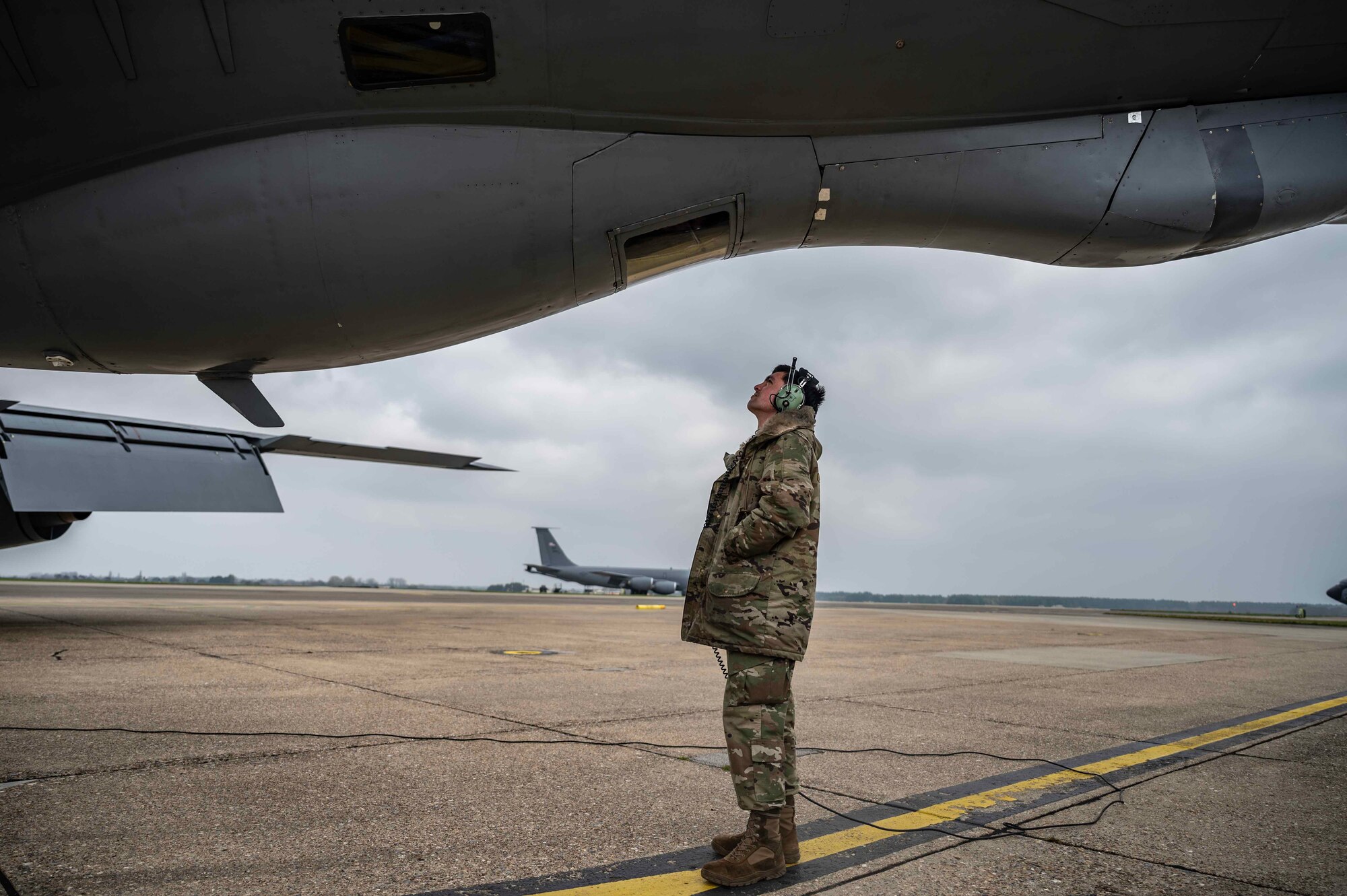 U.S. Air Force Senior Airman Cameron Wilson, 100th Aircraft Maintenance Squadron electrical and environmental journeyman, performs pre-flight checks on a KC-135 Stratotanker aircraft from the 100th Air Refueling Wing at Royal Air Force Mildenhall, England, Mar. 7, 2024. Pre-flight checks are an essential part of flying operations, ensuring the safety of both the aircraft and aircrew. (U.S. Air Force photo by Senior Airman Viviam Chiu)