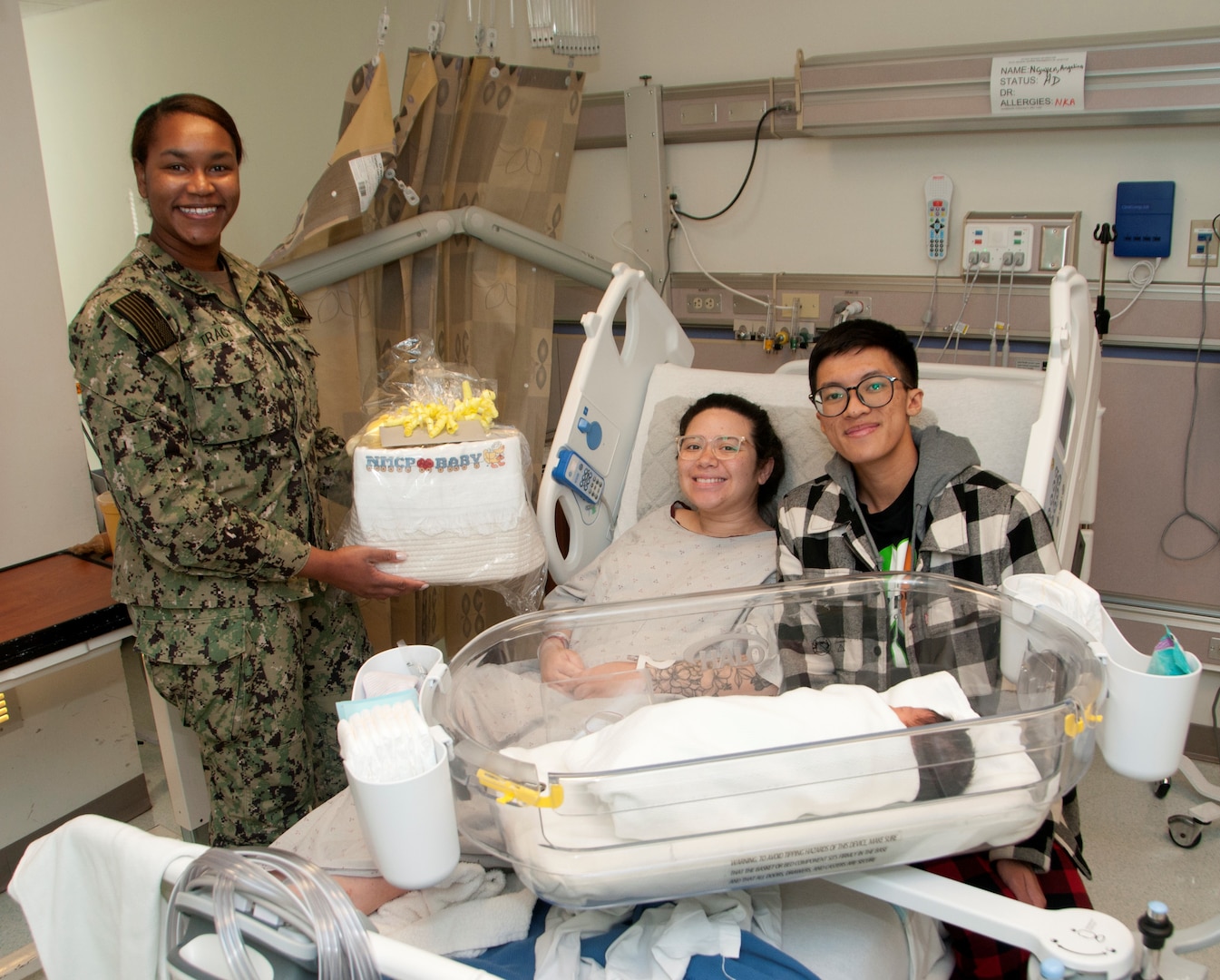 PORTSMOUTH, Va. (Jan. 2) It’s a ‘Happy New Year’ for two Sailors who became parents of the first baby born at Naval Medical Center Portsmouth (NMCP), Jan. 1. IT2 Angelina Nguyen, stationed at Naval Special Warfare Group Four (NSWG4), gave birth to Mahina at 5:08 a.m. on the first day of the new year. Her husband, IT2 Kevin Nguyen, stationed at Beach Master Unit (BMU) 2, was at his wife’s side when she received the First Baby Born 2024 basket provided each year by The Oakleaf Club of Tidewater. Lt. j.g. Mikala Tracy, the patient’s nurse, presented the basket filled with various baby items to the new parents on behalf of the club.