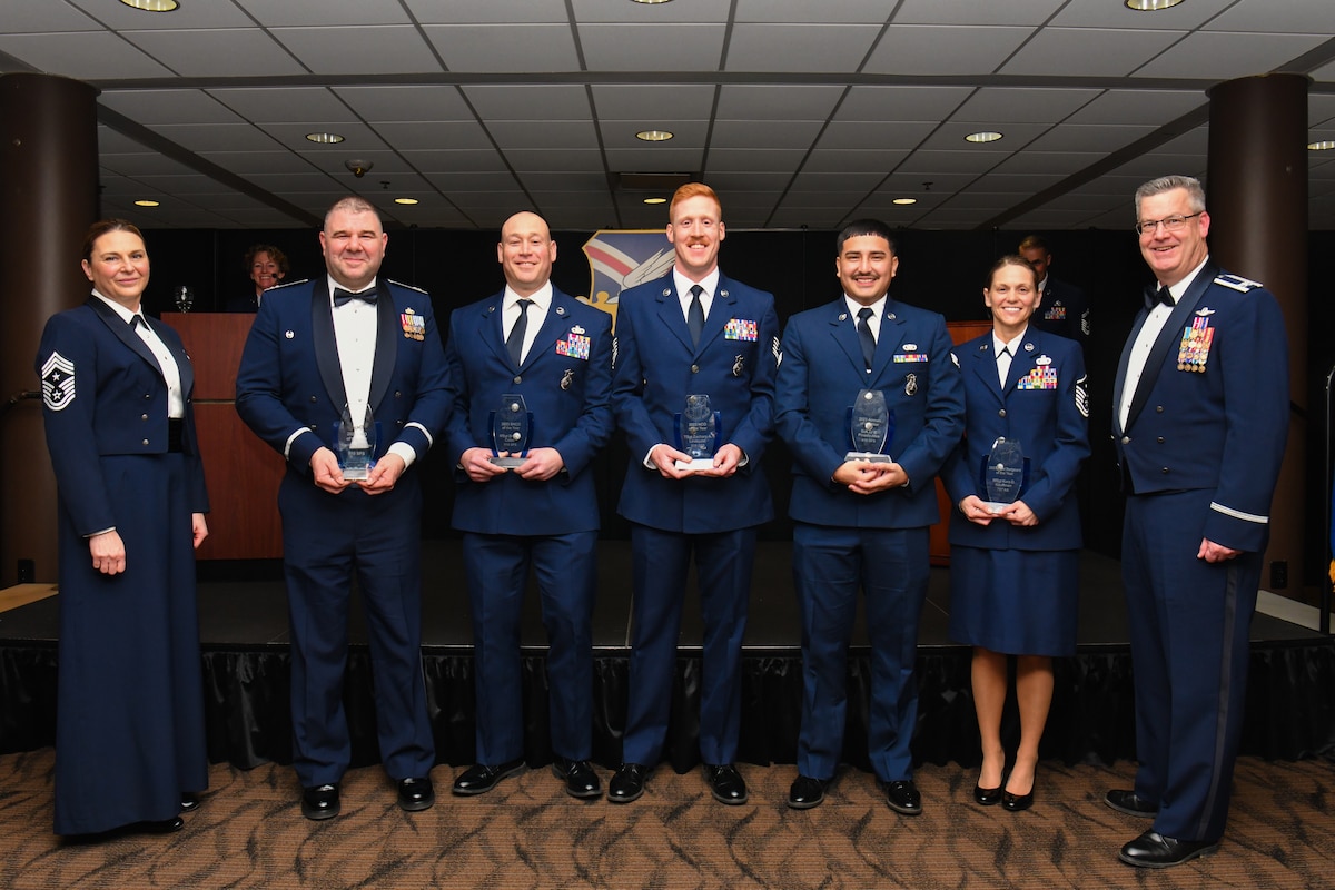 The 910th Airlift Wing’s 2023 Airman of the Year winners pose for a photo with 910th Airlift Wing Commander Col. Michael Maloney (right) and 910th AW Command Chief Master Sgt. Jennifer McKendree (left) during the unit’s annual awards banquet, March 2, 2024, at Youngstown Air Reserve Station, Ohio.