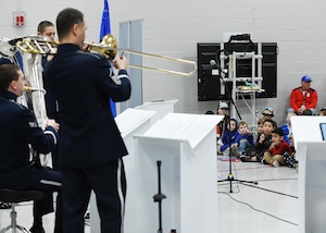 Children listen to music from Air Force members