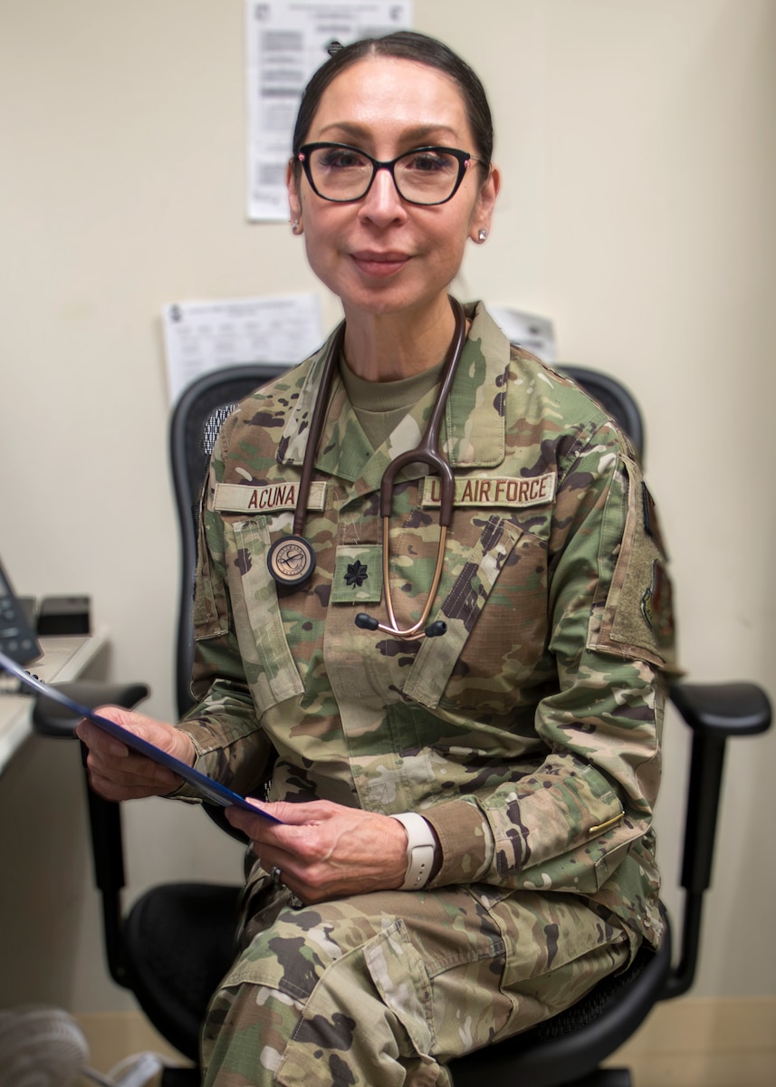 Lt. Col. Delia Acuna sitting in a chair.