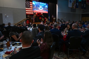 Members of the 22nd Air Refueling Wing clap during the wing's Annual Awards Ceremony March 7, 2024, at McConnell Air Force Base, Kansas. This year, the ceremony was a Hollywood-style theme where the wing recognized and reflected on the accomplishments and efforts of its Airmen over the past year. (U.S. Air Force photo by Airman 1st Class William Lunn)