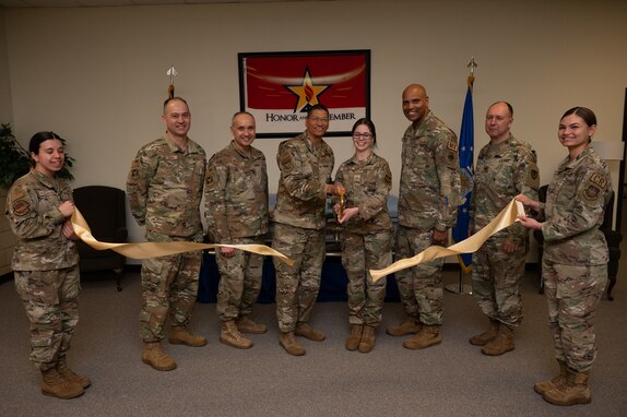 Joint Base senior leaders and U.S. Air Force Honor Guard Airmen cut a ribbon during a ceremony for the opening of the new Honor Guard facility at Joint Base McGuire-Dix-Lakehurst, N.J., March 7, 2024. The JB MDL Honor Guard provides ceremonial services to five different states within the Northeast region of the country. (U.S. Air Force photo by Airman 1st Class Aidan Thompson)