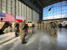 Soldiers listen to the U.S. Vice President Kamala Harris speak
