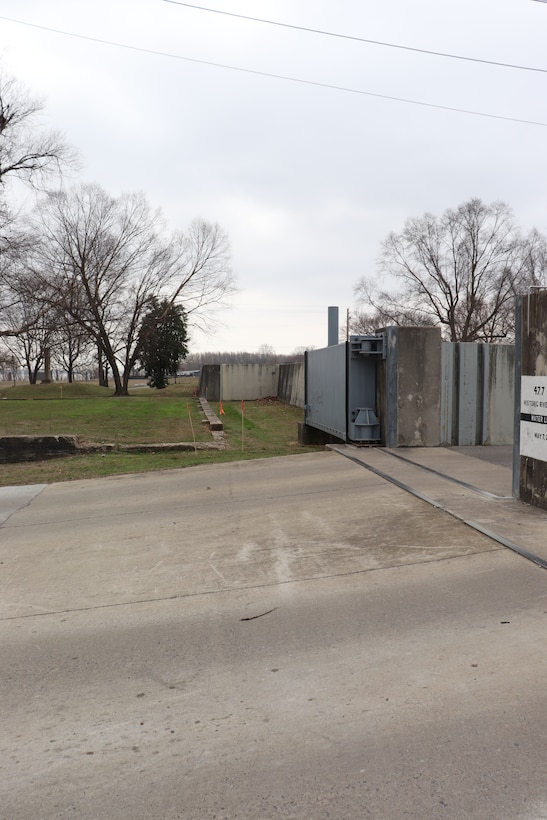 Interior view of existing floodwall at the Ward Avenue opening looking downstream (towards the southeast) with portions of Reynolds Park and batture in background.