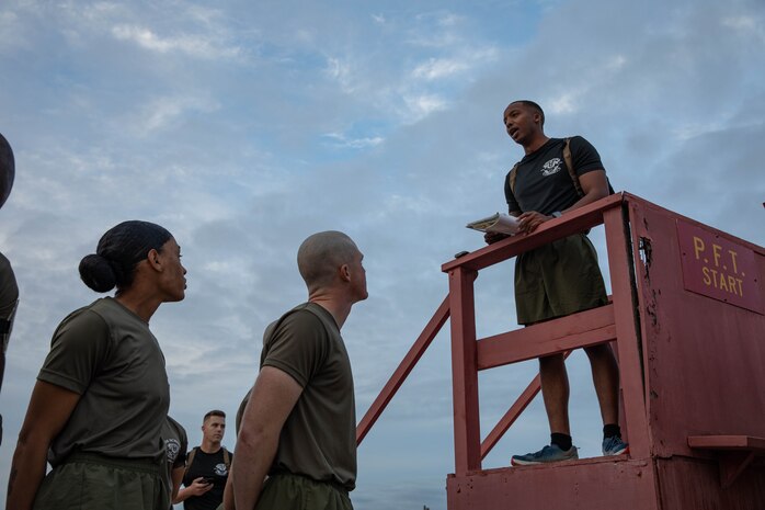 U.S. Marine Corps Gunnery Sgt. Duane Levy Jr., right, a physical training instructor with Drill Instructor School, Recruit Training Regiment, briefs the students prior to conducting the three mile run portion of their physical fitness test at Marine Corps Recruit Depot San Diego, March 5, 2024. Drill Instructor School further develops leadership qualities, command presence, instructional ability, physical fitness, and knowledge of selected officers, Staff Non-Commissioned and Non-Commissioned Officers in order to successfully perform the duties of a drill instructor. (U.S. Marine Corps photo by Cpl. Sarah M. Grawcock)