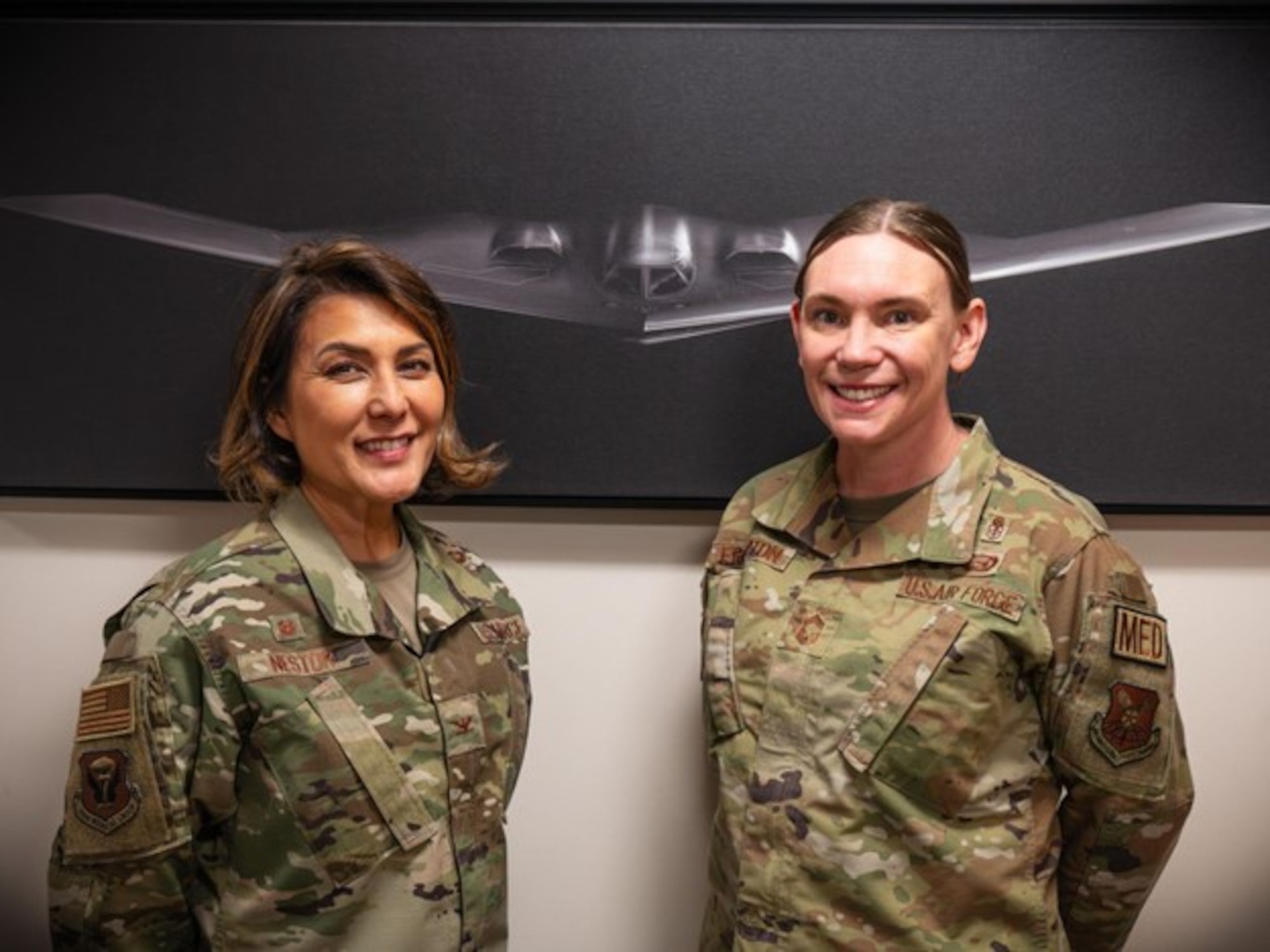 U.S. Air Force Col. Sandra Nestor and Chief Master Sgt. Amanda Frampton, 509th Medical Group commander and senior enlisted leader, pose for a photo at Whiteman Air Force base, Feb. 22, 2024.