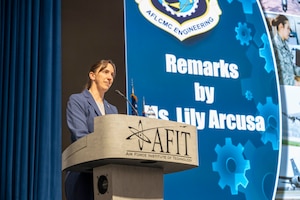 Lily Arcusa, engineering directorate director and technical management chief engineer, provides remarks during the directorate's annual awards ceremony on Feb. 21, 2024 at Air Force Institute of Technology's Kenny Hall on Wright-Patterson Air Force Base, Ohio. The ceremony celebrated excellence among team members, with 19 awards presented to both military and civilian Airmen. (U.S. Air Force photo by Staff Sgt. Mikaley Kline)