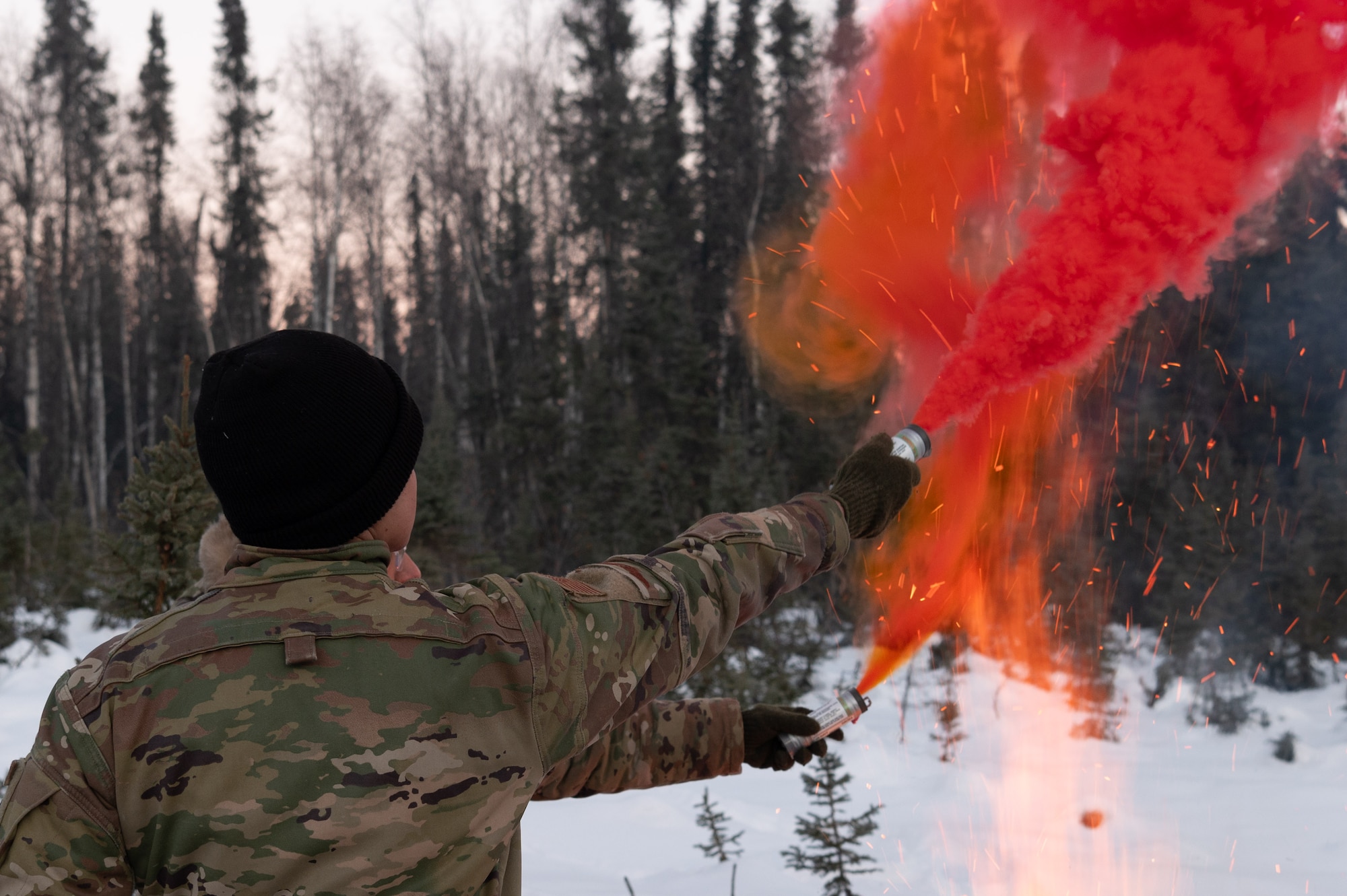 Arctic survival students of class 24-09, element one, use MK-124 signaling flares at their ground-to-air signal (GTAS) area in the Arctic field training area on Eielson Air Force Base, Feb. 16, 2024.