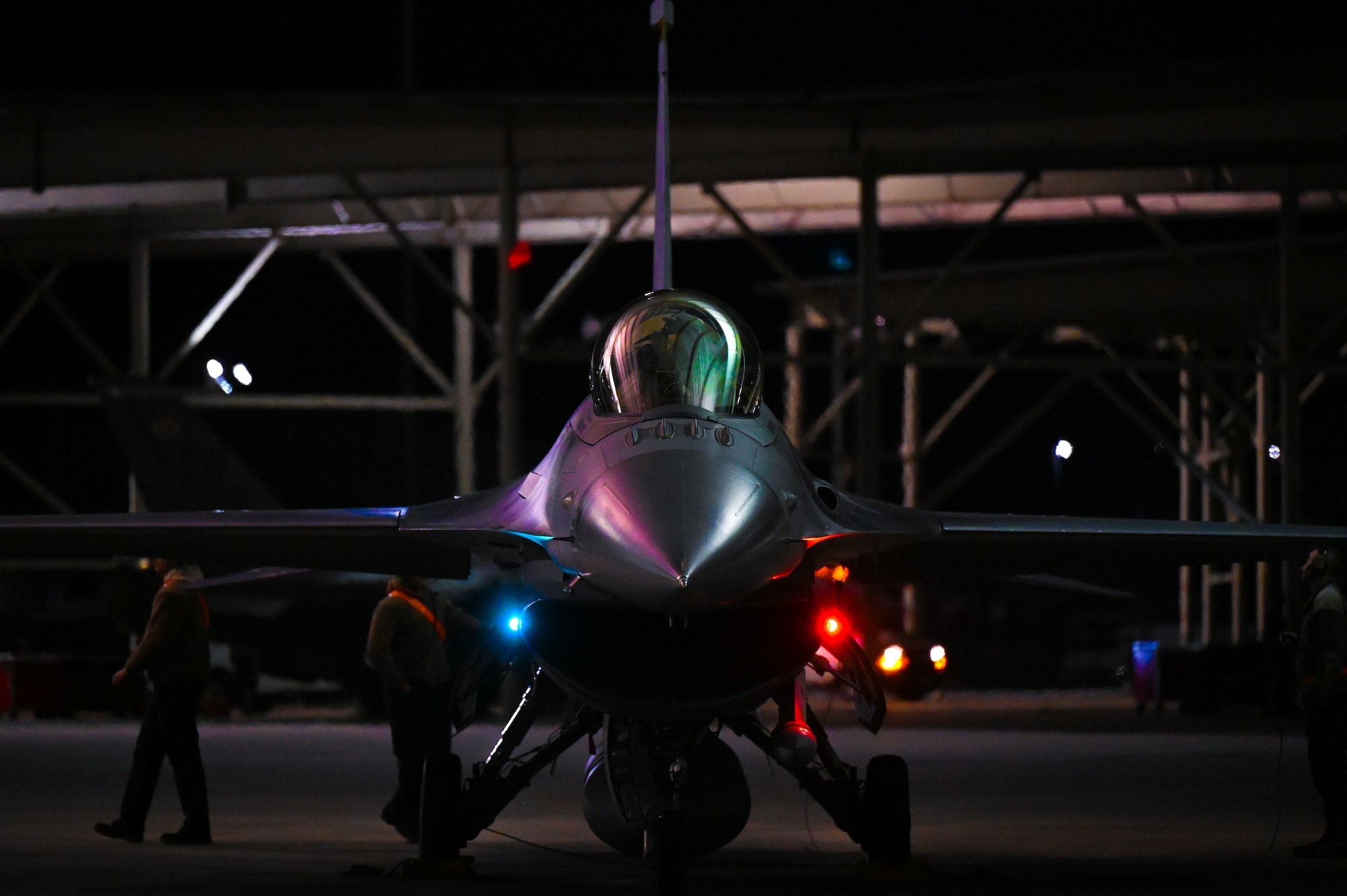 Jet positioned in the middle while being worked on by maintainers.