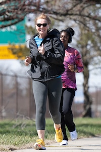 Participants approach the finish line of the 2024 Women’s History Month 5K at Dover Air Force Base, Delaware, March 8, 2024. The run kicked off Dover AFB’s observance of Women’s History Month that will feature several events celebrating the social, economic, cultural and political achievements of women. (U.S. Air Force photo by Mauricio Campino)